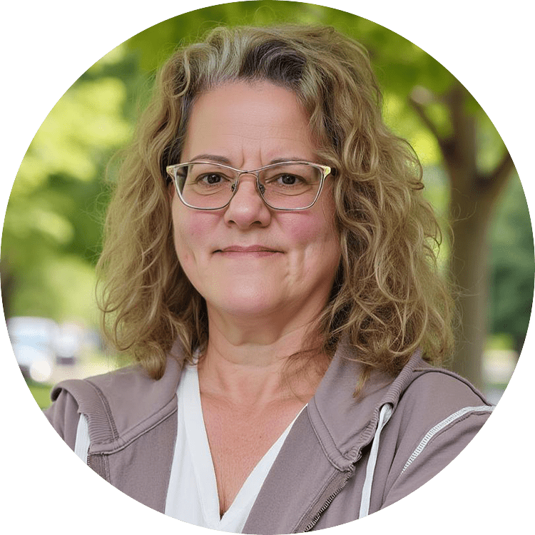 Woman smiling outdoors with glasses