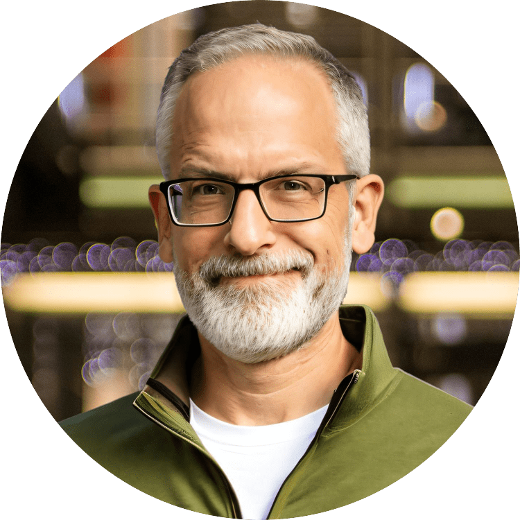 Man with white beard, wearing glasses