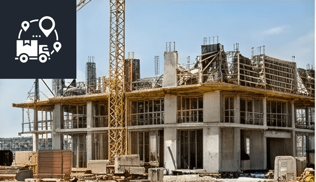 Construction site with workers and machinery building a concrete structure.
